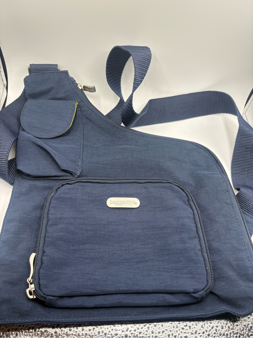 Baggallini navy blue crossbody sling with front zip pocket BRAND NEW